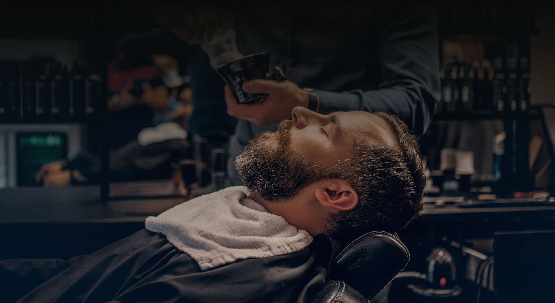 Roosters man receiving beard shave